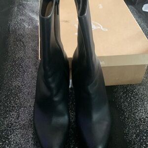 Red bottom boots worn at bottom but to scuffs